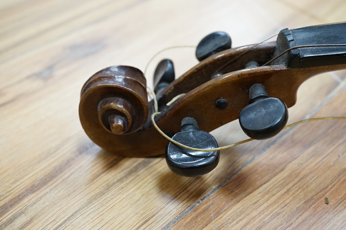 A quarter-size German violin, back measures 31cm. Condition - fair
